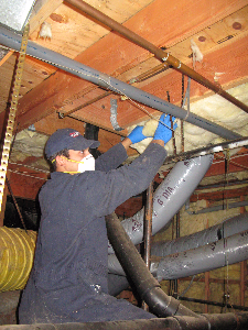 Technician working on Crawl Space Ventilation