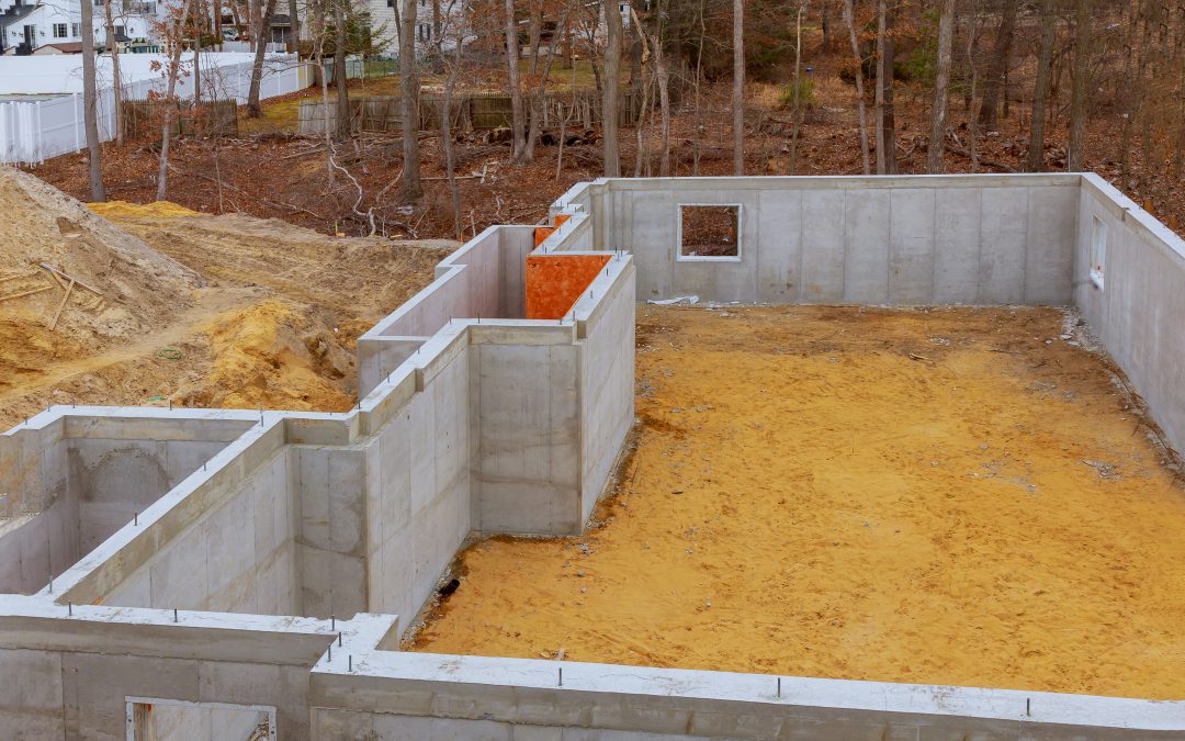Under construction foundation new home with cement basement foundation